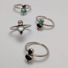 The Present Ring features a delicate and modern design. Adorned with tiny gemstones, sprinkled with dotted details, beautifully set on a slender band. Wear it alone for a minimalist look or mix it with other pieces for a personal expression. Material: 925 Sterling Silver Gemstone options:  * Moonstone + Abalone Shell * Turquoise + Abalone Shell  Also available with Black Onyx + Tibetan Turquoise and Black Onyx The band is approximately 1 mm. Please note due to the nature of stones and shells eac Minimalist Adjustable Moonstone Ring With Natural Stones, Stackable Minimalist Moonstone Ring, Minimalist Natural Stone Rings For Everyday, Minimalist Adjustable Gemstone Midi Rings, Natural Stone Stackable Rings, Dainty Rings With Gemstone Accents, Elegant Silver Stackable Rings With Natural Stones, Minimalist Rings With Natural Stones, Dainty Sterling Silver Rings With Gemstone Accents