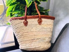 This bag is handwoven in the souks of Morocco, from a palm leaf. It is a "Slow Fashion" product representing everything that is eco, ethical and green. Even though this Spring & Summer season is all about straw. Small round wicker french basket, handwoven in Marrakech by friends and family. Ideal small shopper or beach bag. Also a perfect bag or gift for a girl - great for school books etc 🤍  They look great in the home for storing toys or magazines. Handwoven by women in Morocco using palm lea French Market Bag, French Basket, Storing Toys, French Market Basket, Grocery Market, French Baskets, Market Basket, Straw Basket, French Market