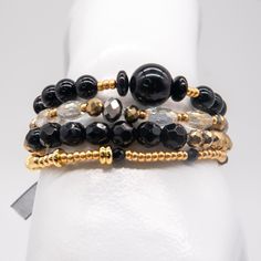 Introducing our Glam Black & Gold Bracelet – a luxurious blend of sophistication and opulence. This exquisite accessory features a harmonious combination of onyx, crystal, and coral beads, carefully curated to create a stunning visual impact. The deep allure of black onyx, the sparkling brilliance of crystals, and the rich warmth of coral beads come together, evoking a sense of glamour and refinement. Elevate your style with the bold contrast of black and gold, adding a touch of mystique to your