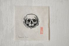 a piece of paper with a drawing of a skull on it