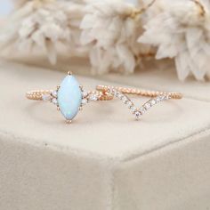 Experience a twist of elegance with our unique Marquise Cut Natural White Opal Ring Set in Rose Gold. It's a symbol of sophistication and beauty Marquise Engagement Ring Opal, Marquise Opal Ring, Elegant Rose Gold Opal Ring With Diamond, Marquise Opal Jewelry Gift, Elegant Gift Opal Ring Marquise Shaped, White Opal Ring, Twist Ring, Rose Gold Engagement, Marquise Cut