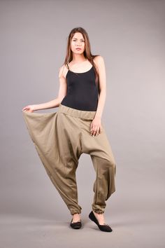 "Linen Harem Pants, Harem Trousers, Baggy Pants, Loose Pants. Extravagant harem trousers with interesting and unusual cut. The baggy pants are loose fit and feature drop crotch. The model is made of linen fabric so it is extremely comfortable women pants suitable for the daytime. If you are looking for the perfect addition to your casual outfit these loose pants are a great choice matched with flats or sneakers. ^ Sizes: The item can be made in sizes from XXS to 7XL. Please, use the size chart b Baggy Full-length Khaki Parachute Pants, Non-stretch Khaki Cotton Pants, Loose Fit Full Length Khaki Pants, Casual Non-stretch Harem Bottoms, Baggy Cotton Wide Leg Pants In Khaki, Khaki Cotton Non-stretch Wide Leg Pants, Baggy Full-length Khaki Bottoms, Baggy Khaki Wide Leg Cotton Pants, Baggy Wide Leg Khaki Bottoms