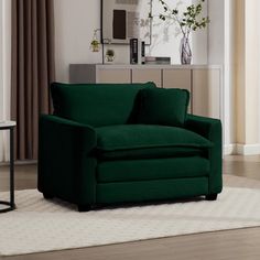 a living room scene with focus on the green couch