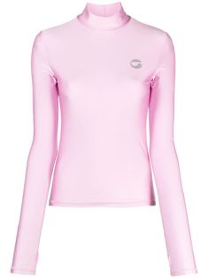 bubblegum pink stretch-design logo print at the chest mock neck long sleeves thumb slots straight hem Athleisure Turtleneck Top, Pink Long Sleeve Tops With Thumbholes, Fitted Pink Tops With Thumbholes, Fitted Pink Top With Thumbholes, Trendy High Neck Pink Top, Trendy Pink Long Sleeve Top, Casual Pink Tops With Thumbholes, Pink Turtleneck Tops, Pink Long Sleeve Top With Logo Print