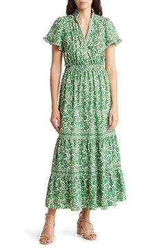 A smocked waist defines the silhouette of a maxi dress finished in a bold pattern for eye-catching appeal. 52 3/4" length Front button closure Split neck Short sleeves 100% polyester Machine wash, line dry Imported Fitted V-neck Maxi Dress With Elastic Waistband, Modest V-neck Dress With Smocked Back, Green V-neck Maxi Dress With Smocked Back, Garden Party Maxi Dress With Smocked Bodice, Modest V-neck Dress With Elastic Waistband, Green Midi Dress With Flutter Sleeves, Fitted Ruched Smocked Maxi Dress, Fitted Dress With Smocked Bodice And Flutter Sleeve, Spring Maxi Dress With Smocked Back And Flowy Skirt