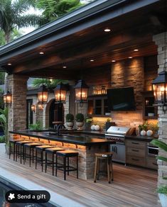 an outdoor kitchen with bar seating and lights on the ceiling is next to a swimming pool