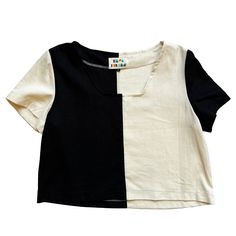 This modern black and cream color blocked patchwork top from Ersa Fibers features a square neckline, short sleeves, loose fit, and slightly cropped length. Its loose fit makes it ideal for layering to be worn year round and its bright bold design and clean lines make it a go-to statement piece. Made in Portland, Oregon Modern White Color Block Tops, Black Patchwork Short Sleeve Tops, Black Boxy Top For Spring, Short Sleeve Patchwork Top In Contrasting Colors, Black Patchwork Summer Tops, Black Patchwork Top For Summer, Contrast Patchwork Short Sleeve Top, Modern Cotton Color Block Tops, Casual Black Color Block Crop Top