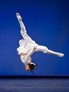 a person doing a handstand in the air