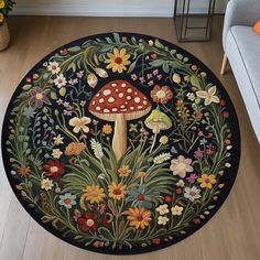 a round rug with flowers and mushrooms on it