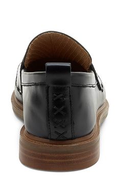 A classic penny keeper and tonal stitching lend elegant polish to a rich leather loafer set on a cushioned footbed and stacked heel. Cushioned footbed Leather upper/textile lining/rubber and synthetic sole Imported Slip-on Wingtip Loafers With Leather Footbed, Classic Closed Toe Leather Shoes With Cushioned Footbed, Classic Closed Toe Moccasins With Cushioned Footbed, Classic Closed Toe Dress Shoes With Cushioned Footbed, Classic Oxfords With Cushioned Footbed And Flat Heel, Classic Oxfords With Cushioned Footbed, Leather Oxfords With Cushioned Footbed For Office, Wingtip Leather Shoes With Cushioned Footbed For Work, Cushioned Wingtip Leather Work Shoes