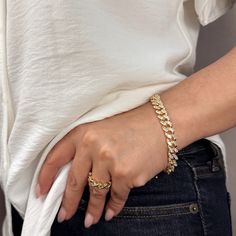 Indulge in luxury with our 18k Gold Filled Iced Chunky Cuban Bracelet. The sparkly, glamorous design will elevate any outfit, making you feel like a true fashion icon. Treat yourself or a loved one to the ultimate statement piece. Metal: 18k Gold Filled AAAAA Cubic Zirconia Stones Sizes : 7.25 inches +2 inches extender Hypoallergenic Water-resistant Handcrafted in Brazil Tarnish Resistant Bangle Chain Bracelet For Party, Glamorous Jubilee Bracelet Jewelry Gift, Trendy Gold Plated Chain Bracelet For Party, Luxury Yellow Gold Bracelets, Tarnish Resistant Gold Bracelet For Party, Luxury Cuban Link Jewelry For Party, Luxury Gold Plated Bracelets For Party, Modern Diamond Bracelets For Party, Glamorous Bracelets With Diamond Accents As Gift