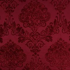 a red wallpaper with an ornate design on it