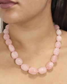 Natural untreated Rose Quartz Crystals in graduating sizes are worked into luscious beads in this gorgeous hand-strung necklace. A vintage classic, this eminently wearable necklace will be treasured for years to come. Sivalya Natural Rose Quartz Crystals Style: Knotted with Clasp Crystals Size: 1" - 1.5" Necklace Length: 20 inches Cut: Natural Untreated Cabochons Rose Quartz: Love, Friendship, Inner Healing Crystals Necklace, Quartz Crystal Necklace, Inner Healing, Rose Quartz Beads, Quartz Crystals, Rose Quartz Crystal, Pink Quartz, Summer Jewelry, Necklace Length