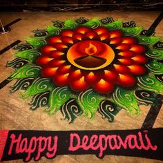 this is a happy deepavai festival with colorful rangolim on the floor