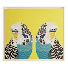 two parrots are standing next to each other on a yellow background