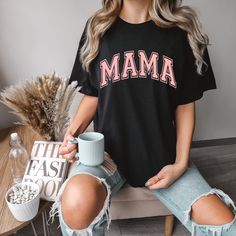 "Stand out in style with our Comfort Colors \"Pink Varsity Mama\" shirt. Featuring a vibrant pink color and a varsity-inspired design, this shirt showcases your mama spirit in a trendy and fashionable way Check out our other Mama and Family Listings: https://etsy.me/43SQ4gq All clothing and accessories from The Southern Thistle are handmade-to-order, just for you! ☺️  SIZING: Tshirts and sweatshirts are unisex, classic fit. Please refer to size chart in listing photos for details. Easy measuring tip: Take your favorite shirt, lay it on a flat surface and measure the width (armpit to armpit) and length (top to bottom) Shirts are pre-shrunk but may shrink slightly after washing. CARE INSTRUCTIONS:  For long-lasting print results, wash inside out in cold water ONLY.  For drying, I recommend l Pink College T-shirt With Text Print, Pink Graphic Print T-shirt For Mother's Day, Family Matching Pink T-shirt With Letter Print, Pink Family Matching T-shirt With Letter Print, Pink Letter Print Tops For College, Pink T-shirt For College In Summer, Pink T-shirt For College Summer, Pink College T-shirt For Summer, Trendy Pink Tops For Mother's Day