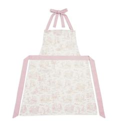 a white apron with pink straps and a bow on the front, it has a light pink