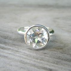 Ooh La La, Love this stunning ring created by http://onegarnetgirl.etsy.com. My finger seems so lonely now. Must get! #handmade #etsy #jewelry #artisan White Topaz Birthstone Ring, Modern Round Topaz Ring With Bezel Setting, Everyday White Ring With Bezel Setting, White Topaz Solitaire Crystal Ring, White Solitaire Topaz Ring, White Crystal Promise Ring With Bezel Setting, Anniversary Round Topaz Ring With Bezel Setting, Everyday White Birthstone Ring, Promise Ring With Round Stone Topaz & Bezel Setting