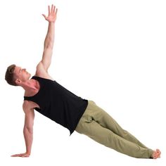 a man in black shirt and khaki pants doing a yoga pose on white background