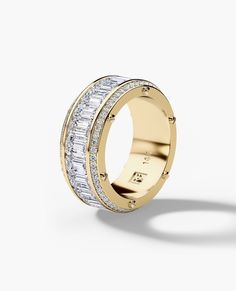 a yellow gold ring with baguets and diamonds