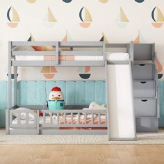 a child's bedroom with bunk beds and wallpaper