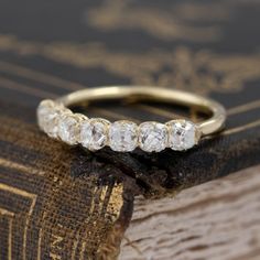 a close up of a ring on top of a book