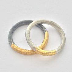 These contemporary silver and gold rings have an organic sculptural form and a modern feel.  Perfect everyday rings, comfortable to wear and ready to make a statement. Created from silver wire, hammered, forged, and heated with soldering torch to reticulate the silver surface, creating a subtle organic texture.  Gold is applied using Keum Boo, an ancient technique fusing 24 gold foil onto the surface of the silver. The gold foil leaves rich gold color. Available in two different finishes the photo represents a matt silver finish with gold and oxidized silver finish with gold.  Please specify your preference in finish option - Matt  - Oxidized - Matt/Oxidized Available as a set or individual.  Set $250, Single $150, please message me if you would like to set up a single ring purchase. Can b Hammered Metal Jewelry, Keum Boo Jewelry, Silver And Gold Rings, Contemporary Rings, Contemporary Jewellery Designers, Keum Boo, Handmade Silver Jewellery, Polymer Clay Jewelry Tutorials, Contemporary Jewelry Design