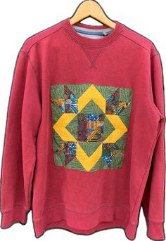 Casual Crew Neck Sweater With Patchwork, Winter Crew Neck Patchwork Sweatshirt, Winter Patchwork Crew Neck Sweatshirt, Fall Cotton Patchwork Sweater, Cotton Patchwork Long Sleeve Sweater, Casual Long Sleeve Quilted Top, Red Patchwork Sweatshirt For Fall, Casual Patchwork Sweater With Relaxed Fit, Casual Crew Neck Sweatshirt With Patches