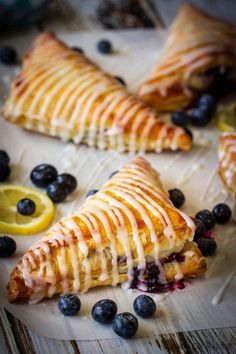 blueberry turnovers with lemon drizzled on them