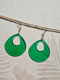 This color is gorgeous.  These green teardrop earrings are classy but fun!  The green is bright but still translucent.  These will make a great addition to any outfit and they can be both casual and dressy.  The teardrop is 1.75 inches in length and 1.5 inches in width.  The overall length is 2.75 inches.   Handmade, lightweight and unique.  Hypoallergenic and nickel free.   Sometimes we just need a little something to brighten our day. Thank you for visiting Rustic Palm Designs, enjoy! Teardrop Earrings, Jewelry Earrings Dangle, Etsy Earrings, Dangle Drop Earrings, Dangle Earrings, Jewelry Earrings, Drop Earrings, Green, Color