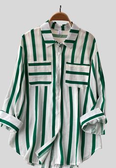 Striped buttoned up shirt -Long Sleeve -Button Front Blouse -PocketMade In: China Striped Long Sleeve Blouse With Pockets, Striped Workwear Shirt With Pockets, Green Collared Shirt With Roll-up Sleeves, Spring Green Shirt With Roll-up Sleeves, Trendy Striped Tops With Pockets, Striped Blouse With Pockets Relaxed Fit, Green Roll-up Sleeves Shirt For Spring, Trendy Green Shirt With Pockets, Green Button-up Shirt With Placket