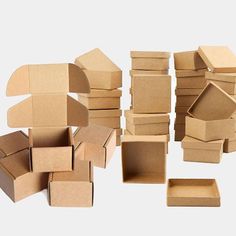 several cardboard boxes are stacked on top of each other, with one open box in the middle