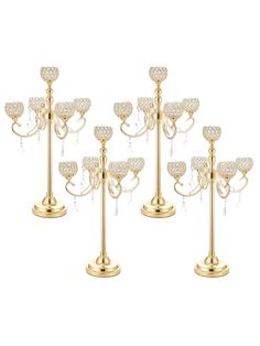 six gold candle holders with crystal hearts on them