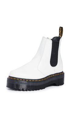 PRICES MAY VARY. This season, the boot gets an empowering boost from an aggressive, 1 1/2 inch platform sole — and now comes in show-stopping white Smooth leather. Constructed on the iconic and comfortable Dr. Martens air-cushioned sole, with a commando tread. Built to last with a durable Goodyear welt. Made with all the classic Docs DNA, including grooved sides, heel-loop and yellow stitching. Dr Martens 2976 Quad, White Platform Boots, 2976 Chelsea Boots, White Dr Martens, White Doc Martens, Dr Martens 2976, Doc Martens Style, Dr Martens White, Chelsea Boots Style