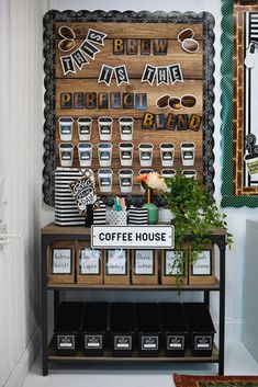 a coffee shop display with cups and signs