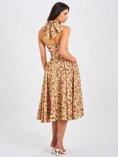 Behold our Niya maxi dress, a stunning union of style and ease. Delicately crafted from a charming floral print fabric, it exudes feminine allure with every step. The drop waist design imparts a contemporary silhouette, while padded cups ensure a flattering fit. Practicality meets elegance with convenient pockets discreetly integrated into the design. Structured with built-in bones and hard mesh supporting the hemline, it promises both form and function. Seamlessly finished with an invisible zip Floral Print Midi Dress With Fitted Bodice, Sundress With Fitted Bodice For Garden Party, Fitted Bodice Sundress For Garden Party, Midi Length, Fitted Midi Floral Dress For Garden Party, Daywear Dresses With Floral Print And Fitted Bodice, Brunch Floral Print Dress With Fitted Bodice, Feminine Fitted Bodice Dress For Garden Party, Feminine Dresses With Fitted Bodice For Garden Party, Spring Floral Print Maxi Dress With Fitted Bodice