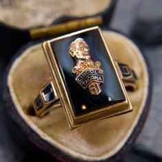 This distinctive class ring features an onyx tablet emblazoned with a cast bust of Abraham Lincoln above the school name "Lincoln" High School in Tacoma, Washington." The shoulders indicate the year of graduation "1961" in enamel detailing. The ring is crafted in 10k yellow gold and is currently a size 8.25. Antique Engagement Rings Sapphire, Estate Jewelry Rings, Tacoma Washington, Brand Presentation, Tacoma Wa, Antique Engagement Rings, Tiffany And Co, European Cut Diamonds, Sapphire Engagement