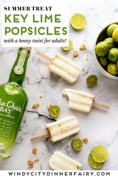 key lime popsicles with a bowl of limes next to them and a bottle of gin