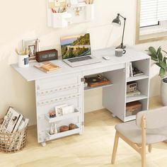 a white desk with a laptop on it