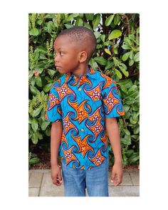 African Print Short Sleeve Shirt  Handmade Cotton Shirt from Ghana  Short sleeve shirt with a neat stitches  and buttons in the front. The colours in the fabric makes it easy to match with any pair of shorts of trousers.  For the casual look get the little one in a khaki shorts  or a pair of jeans.  It is equally stunning with a pair of trousers for a more formal occasion.   Available in Daddy and Me Range!! Sizes and dimensions  1 to 2 year old  Chest 22 Length 17 inches  3 to 4 year old  Chest Fitted Multicolor Traditional Shirt, Traditional Fitted Multicolor Shirt, Fitted Traditional Multicolor Shirt, Traditional Multicolor Fitted Shirt, Blue Fitted Collared T-shirt, Traditional Blue Shirt For Summer, Traditional Blue Fitted Shirt, Traditional Blue Summer Shirt, Traditional Fitted Blue Shirt