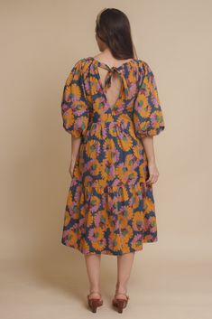 Brand: Moodie Puff sleeve midi dress with vibrant floral print. Dress has side pockets and an open back with tie. ♡ Details Color: Multi Puff sleeves Hidden side pockets Open tie back Partially lined 100% Cotton | Lining; 70% Polyester, 30% Cotton Hand wash recommended Size & Fit Model info: Height 5'3"| Bust 32"| Waist 25"| Hips 34" Model is wearing a size XS Fit: Relaxed fit Stretch: No stretch Measurements: XS: Bust = 35" | Waist = 34" | Length = 42.5" S: Bust = 36" | Waist = 35" | Length = 4 Puff Sleeve Midi Dress, Sleeve Midi Dress, 5 S, Midi Length Dress, Tie Backs, Floral Print Dress, Puff Sleeves, Midi Length, Smocking