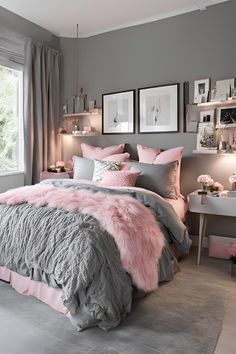 a bedroom with grey walls, pink and gray bedding and pictures on the wall