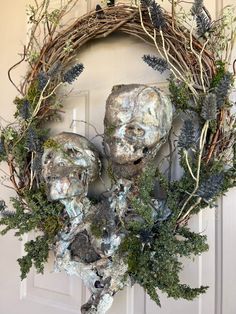 a wreath that has been made to look like an old man's face and branches