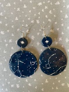 These dangle earrings are made with polymer clay and painted with acrylic paint. The metal is zinc-free in the hooks. They are customisable, with specific constellations (eg. Star signs) or with random constellations- it's your choice. Feel free to message me with any questions. Polymer Clay Galaxy, Constellation Earrings, Acrylic Sign, Star Signs, Diy Earrings, How To Make Wreaths, Constellations, Polymer Clay Earrings, Clay Crafts