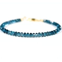 Make a statement with this beautiful bracelet made of 4mm Genuine London Blue Topaz beads! Dazzle your friends with its luminescent hue, and let its unique style stand out from the rest. Blue Beaded Bracelets, 5 Gifts, Minimalist Bracelet, Reiki Healing, London Blue Topaz, Blue Bracelet, London Blue, Jewelry Pouch, Gemstone Bracelet