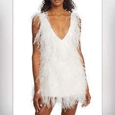 Lamarque's Alena Dress Features A Deep V-Neck And A Mini Length. This Sleeveless Party Style Flaunts Long, Wispy Feathers For Extra Flounce And Dimension. V-Neck Sleeveless Slip-On Style 100% Ostrich Feathers Lining: 97% Polyester/3% Spandex Dry Clean Imported Size & Fit About 31.25" From Shoulder To Hem Model Measurements: 5'10" Tall Model Is Wearing A Us Size Small White Feather Dress, Lace Mesh Dress, Leather Mini Dress, White Feather, Paris Outfits, Feather Dress, Bustier Dress, Party Style, Ostrich Feathers