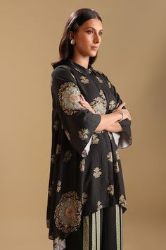 Black cotton silk kurta with floral mandala prints and sequin embellishments. Paired with a pant with printed panels. - Aza Fashions Elegant Blouse Piece With Traditional Drape And Printed Motifs, Elegant Blouse With Printed Motifs, Elegant Blouse With Printed Motifs For Designer Wear, Elegant Festive Blouse With Printed Motifs, Traditional Silk Kurta With Set-in Sleeves, Elegant Silk Kurta With Printed Motifs, Elegant Traditional Wear With Printed Motifs For Formal Occasions, Traditional Silk Sets With Set-in Sleeves, Elegant Traditional Wear With Printed Motifs For Formal Events