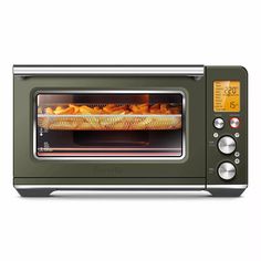 a toaster oven with food cooking in it