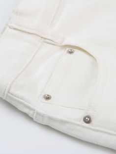 Details: High waist, loose small A shape Raw edge leg design Customized 'URL' embroidered label Cotton stretch white denim material Materials & Care: Cotton 98.2%, Spandex 1.8% 30° water wash, gentle dry clean Do not bleach Size & Fit: Model is 5'7", Bust 32, Waist 24, Hips 35, wearing a size S Item #: IM2DP10 White Short Denim Jeans, White Short Length Denim Jeans, White Straight Leg Shorts With Pockets, Cream Bottoms With Five Pockets For Summer, White Mid-rise Denim Bottoms, Cream Five-pocket Summer Bottoms, Trendy White Straight Leg Jean Shorts, Summer Cream Bottoms With Five Pockets, White High Rise Bottoms With Five Pockets