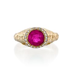 Hypnotizing signet ring: With its mesmerizing Tourmaline Pink color and crown of diamonds, this breathtaking ring stands out in the crowd and radiates glam and luxury. Materials Description:- 14k Gold.- 0.7ct round cut Pink Tourmaline.- 0.12ct vs Diamonds. Pink Tourmaline: "The open-hearted"Pink Tourmaline is a gemstone widely recognized for its ability to emit a gentle yet powerful love energy. It's often referred to as a heart talisman for compassion, as its calming effect can facilitate a tra Diamond Gemstone Signet Ring, Heirloom Diamond Signet Ring With Gemstone, Luxury Yellow Gold Signet Ring With Halo Setting, Luxury Signet Ring With Center Stone For Promise, Luxury Signet Ring With Rose Cut Diamonds, Luxury Signet Ring With Center Stone, Fine Ruby Signet Ring With Gemstone, Fine Jewelry Ruby Signet Ring With Gemstone, Fine Ruby Signet Ring